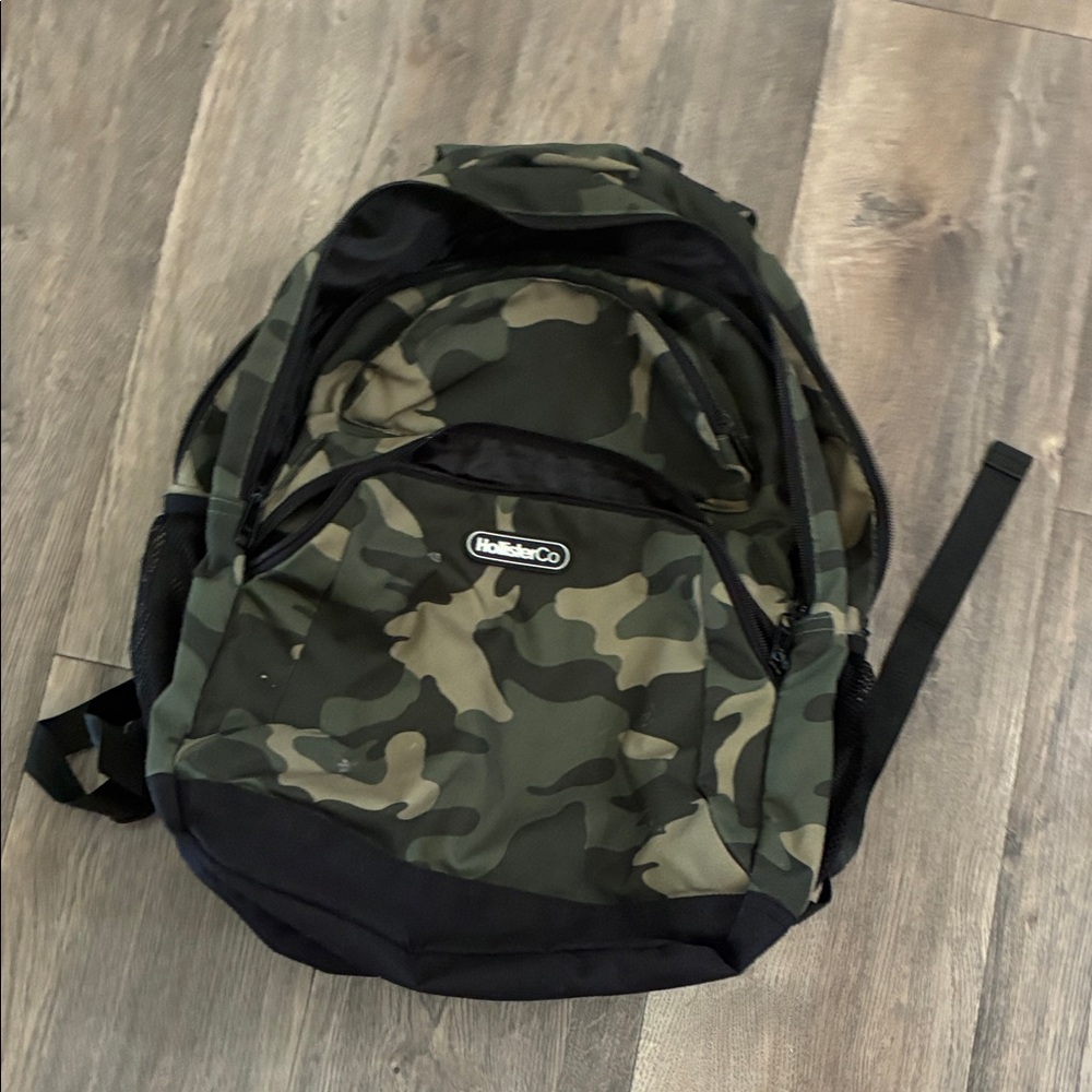 Trendy hollister backpack with green camouflage pattern